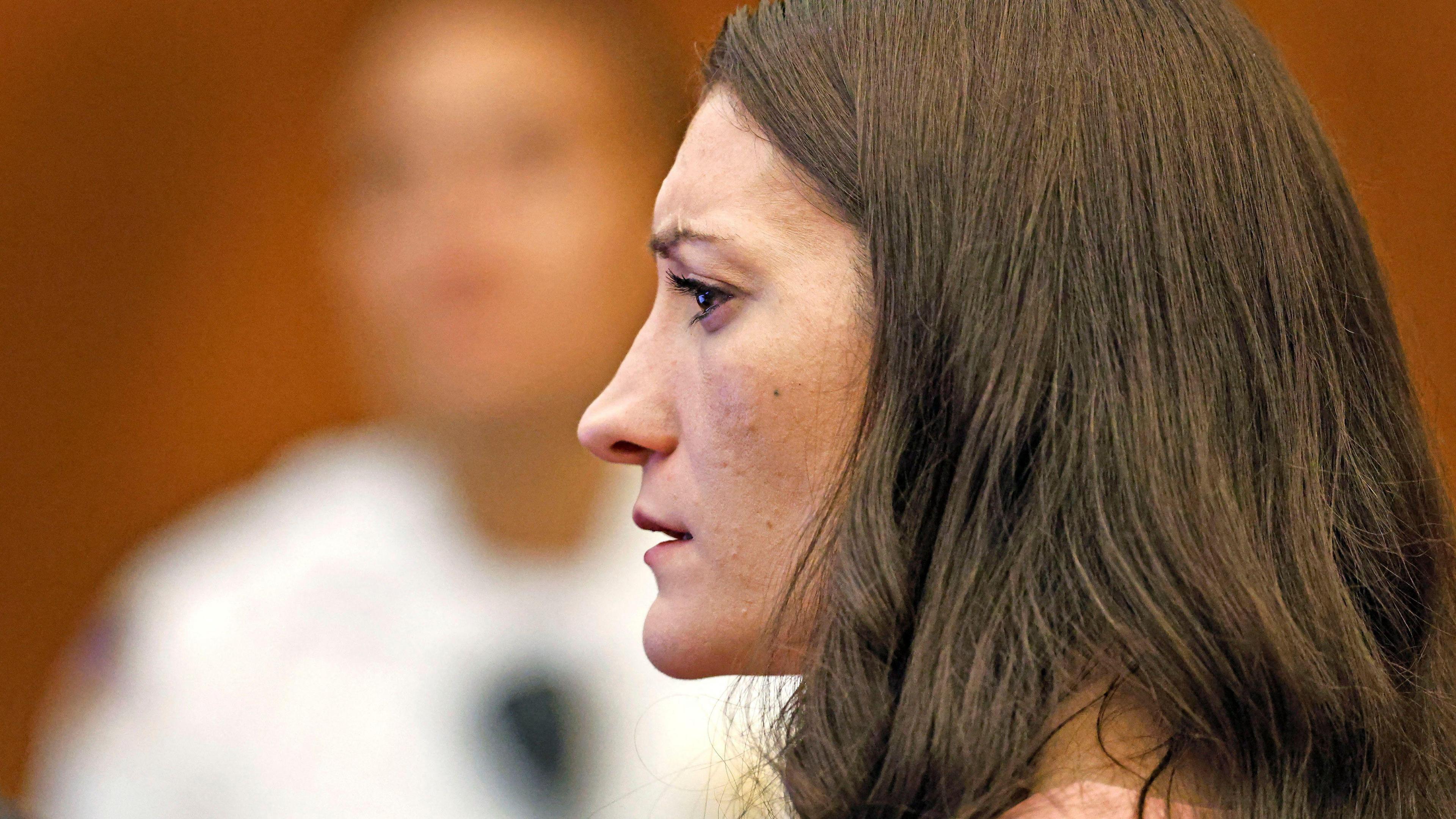 Lindsay Clancy watches as her ex-husband Patrick Clancy takes the witness stand