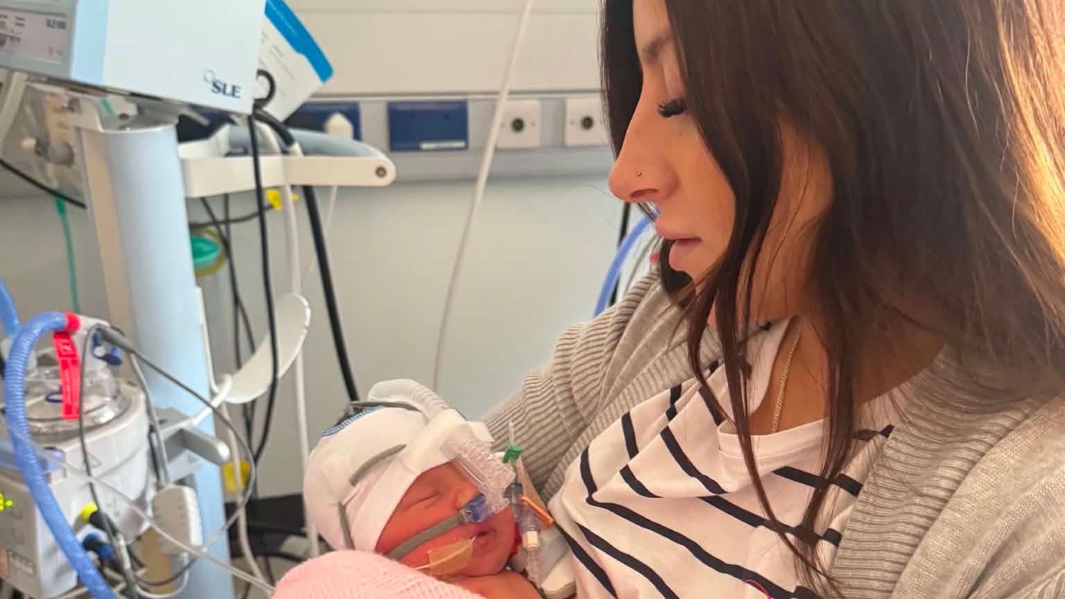 Picture of mother and newborn baby in hospital.