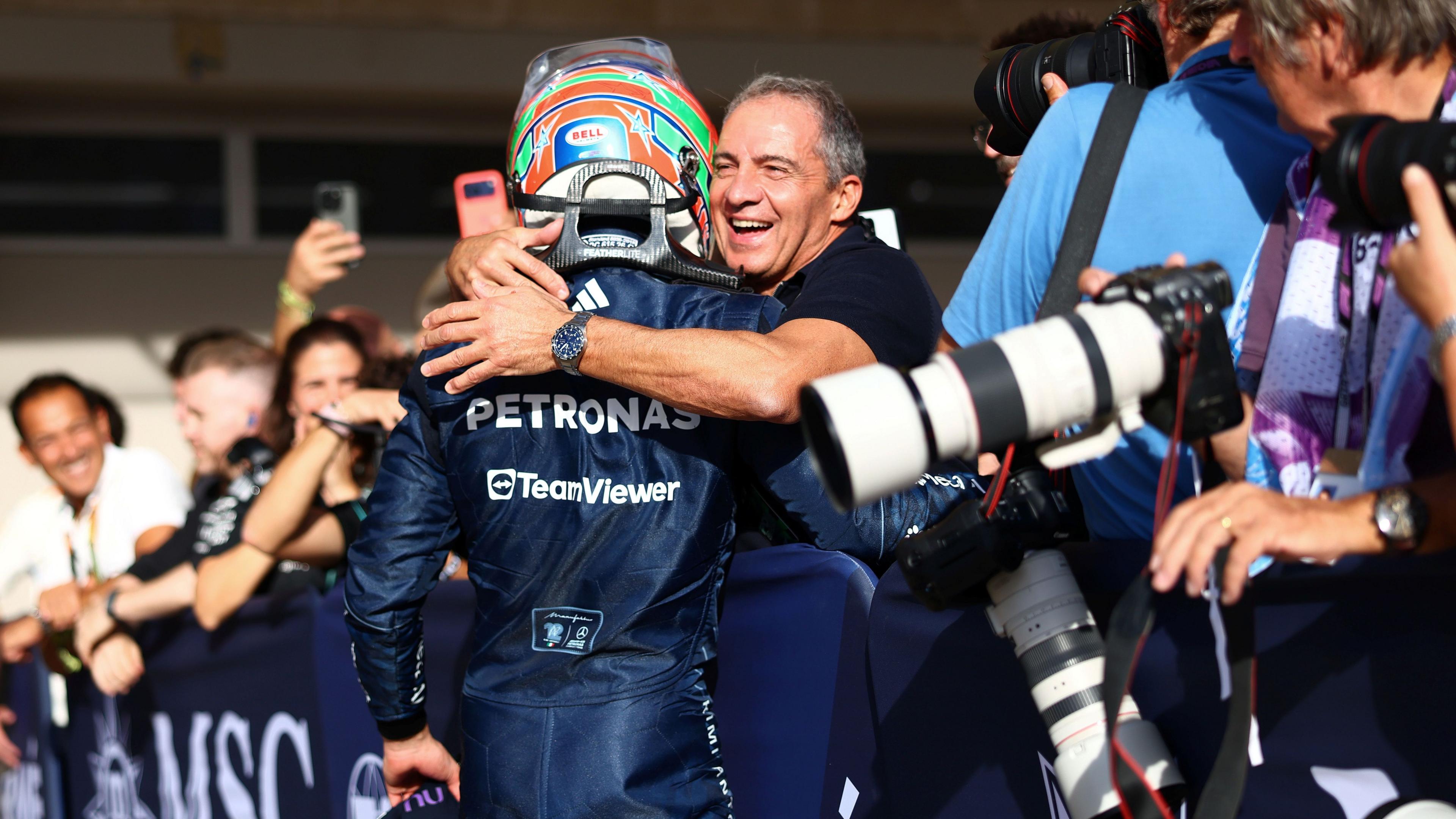 Kimi Antonelli and his father, Marco, hug after the Italian claimed pole position in Austin