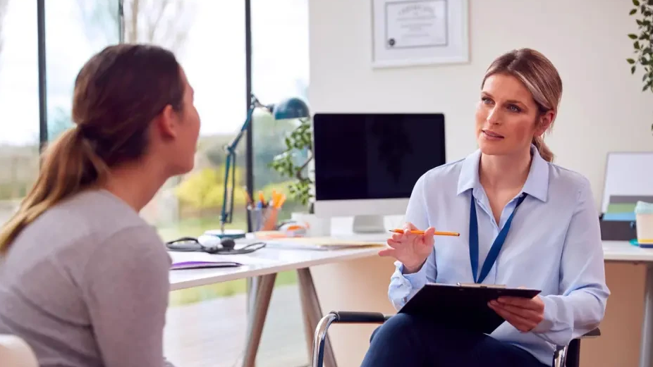 Doctor assessing young person
