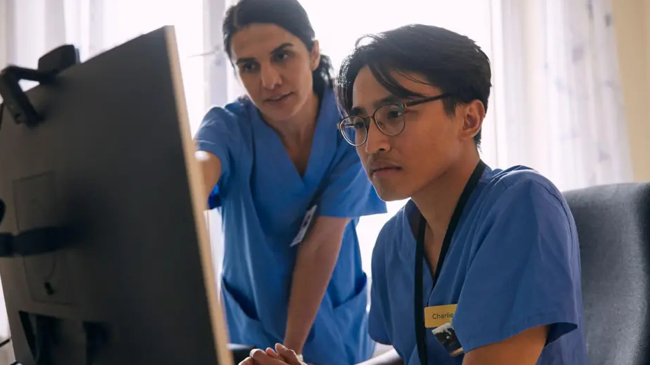 Doctors at a computer
