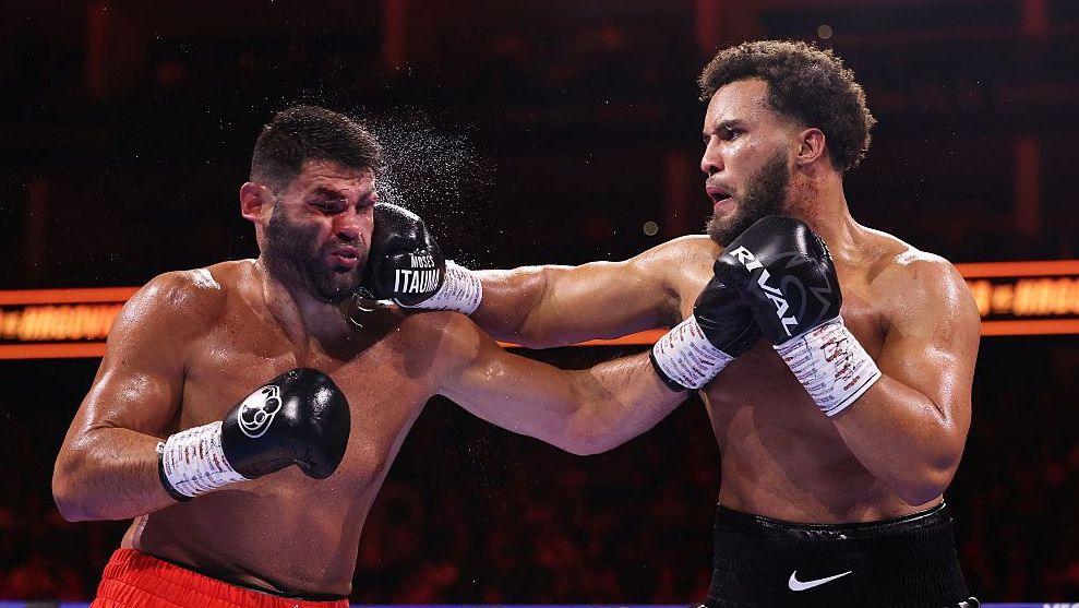 Moses Itauma punching Filip Hrgovic with a right hook to the face during their title fight