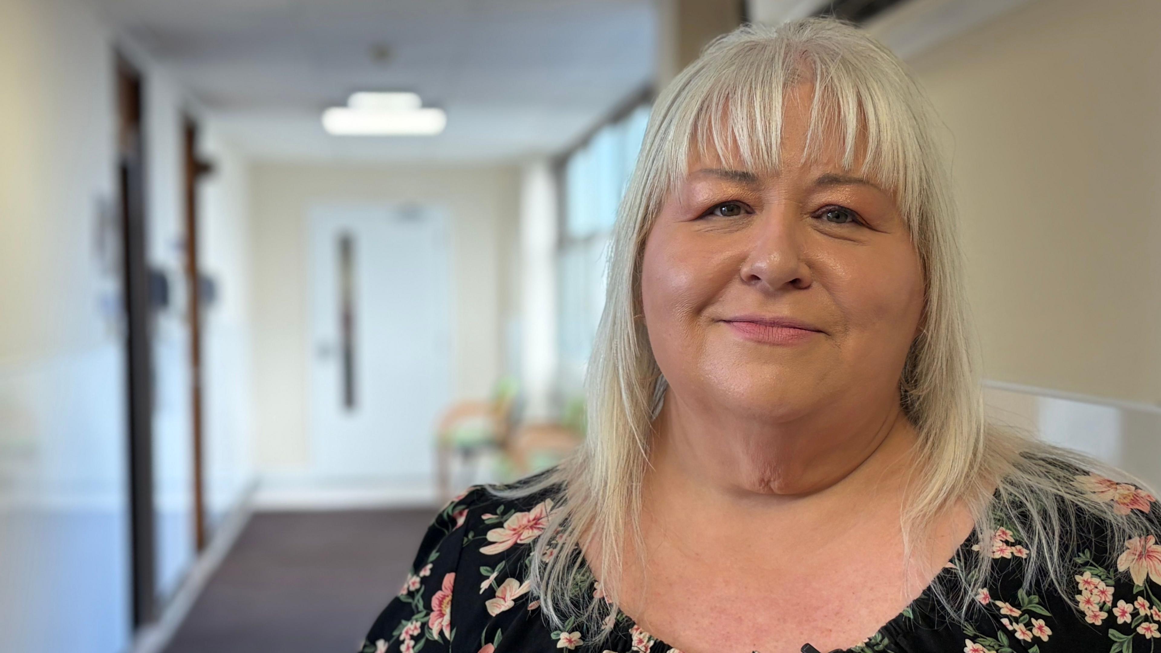 Kathleen McLaughlin with blonde hair and a flowery top has lost 4 stone on NHS Forth Valley's trial of weight loss drugs