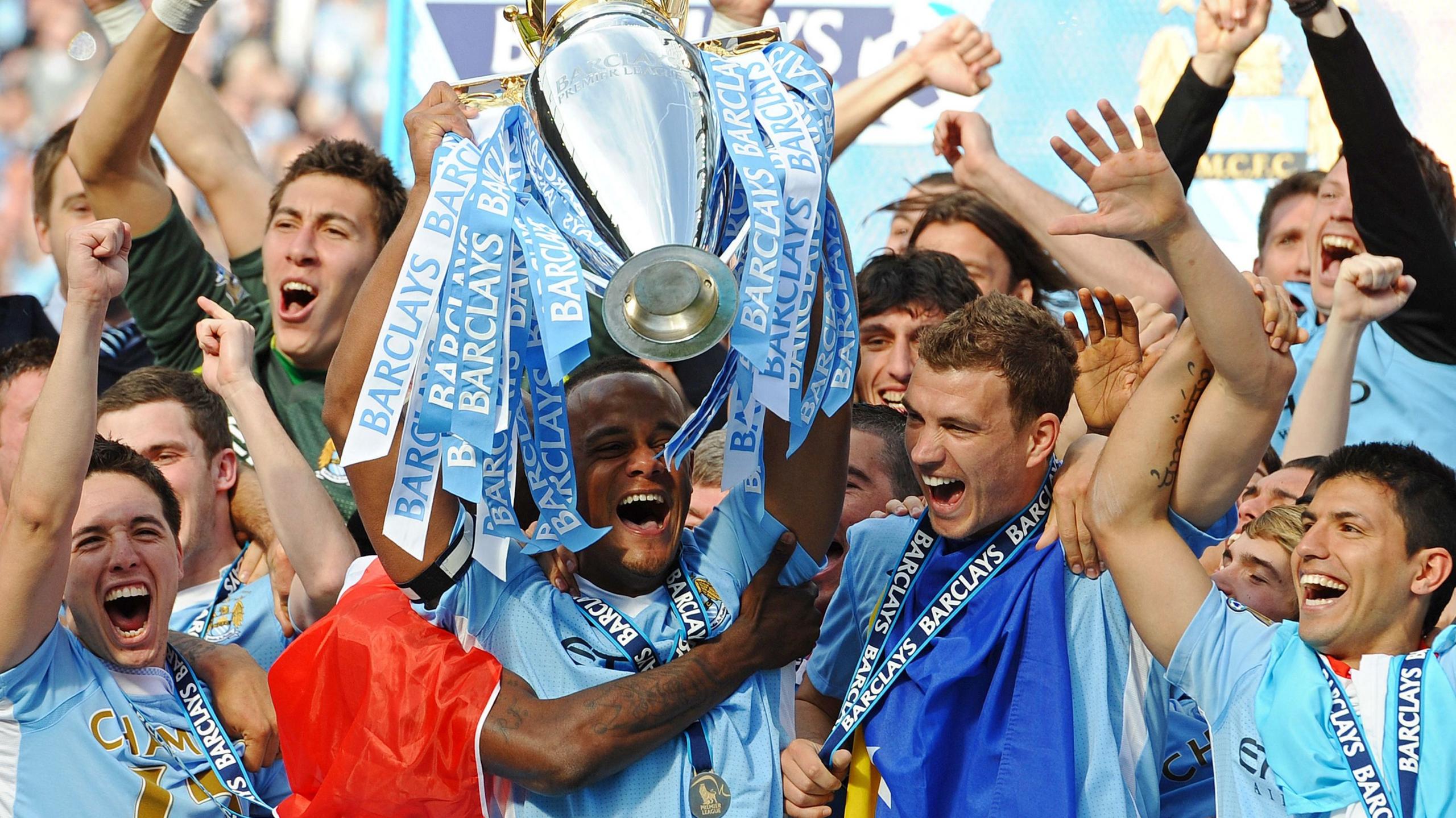 Man City lifting 2012 Premier League trophy