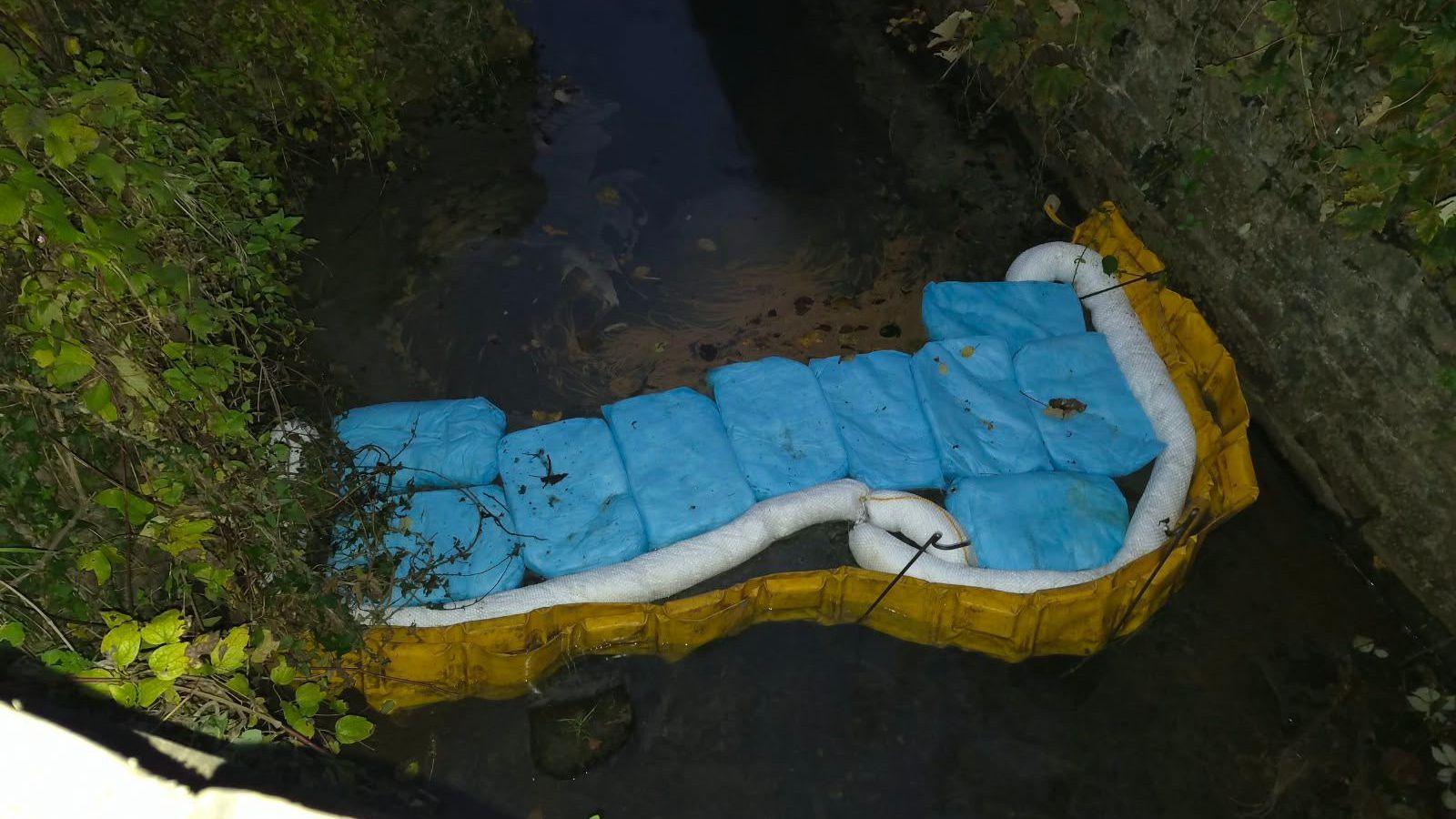 Leak in river Taff, an inflatable plastic buffer has been used to try and stop the leak spreading down the river