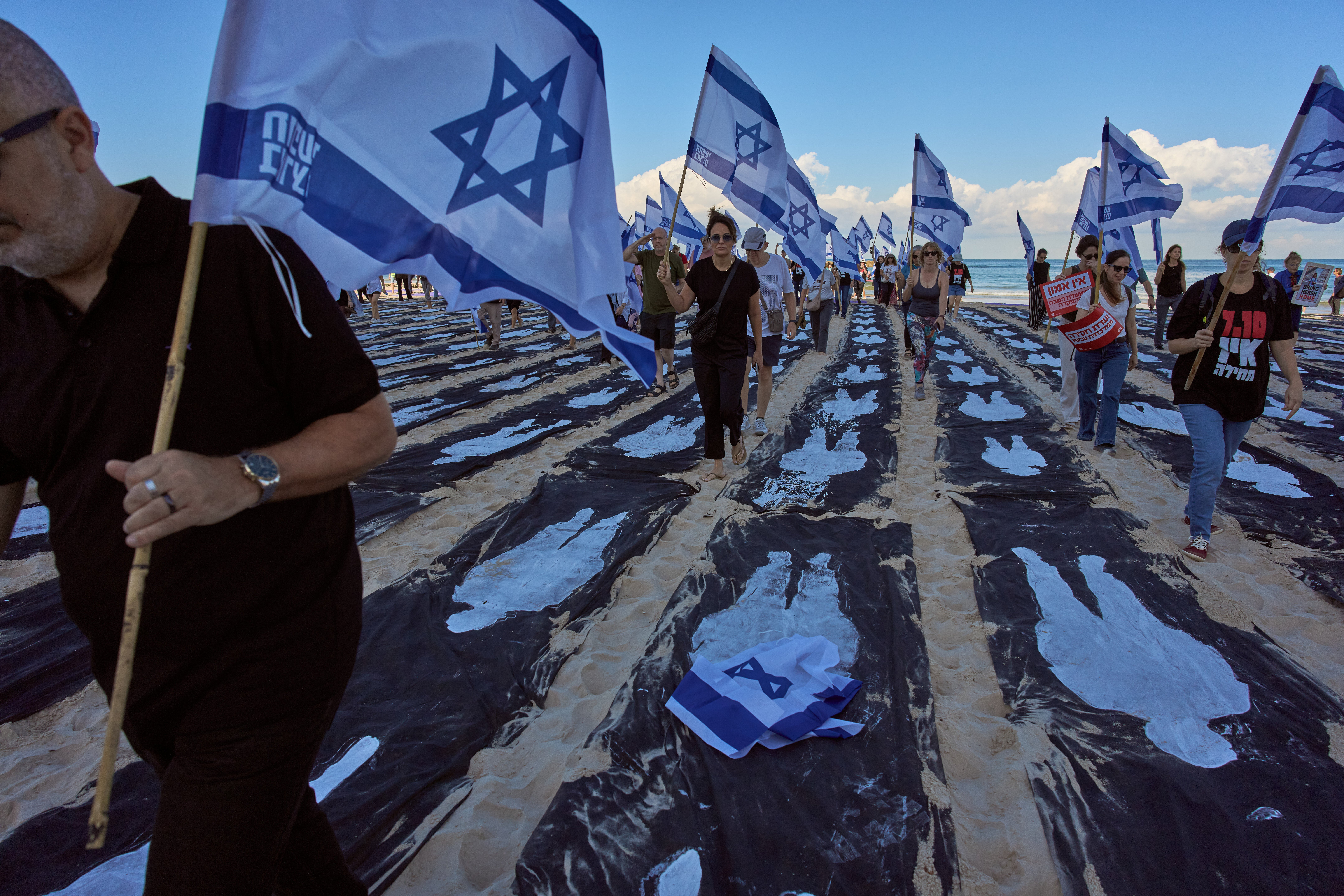 Israelis Mourn Oct. 7 Attack As Palestinians In Gaza Languish In Ruins Of The War It Sparked