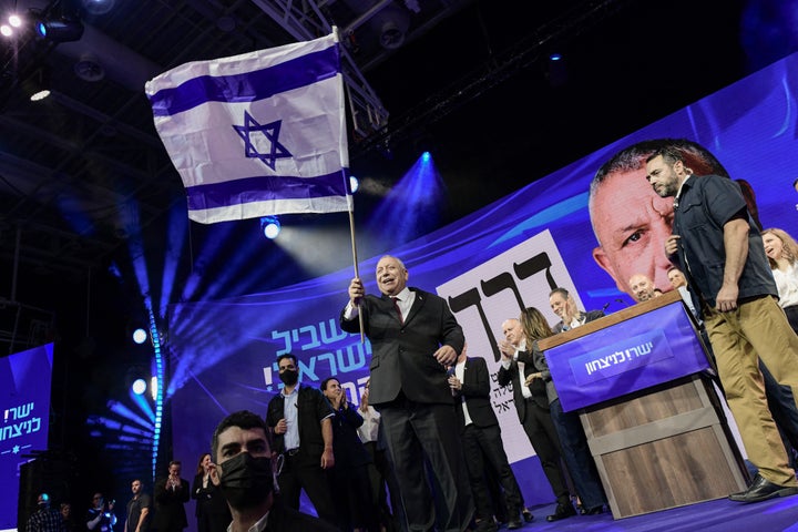 Former Israeli military chief and Yashar party leader Gadi Eisenkot waves an Israeli flag as he addresses supporters at an election-night rally following the announcement of the first exit polls in Tel Aviv, Israel, early on October 28, 2026. (Photo by Tomer Neuberg / Middle East Images / AFP via Getty Images)