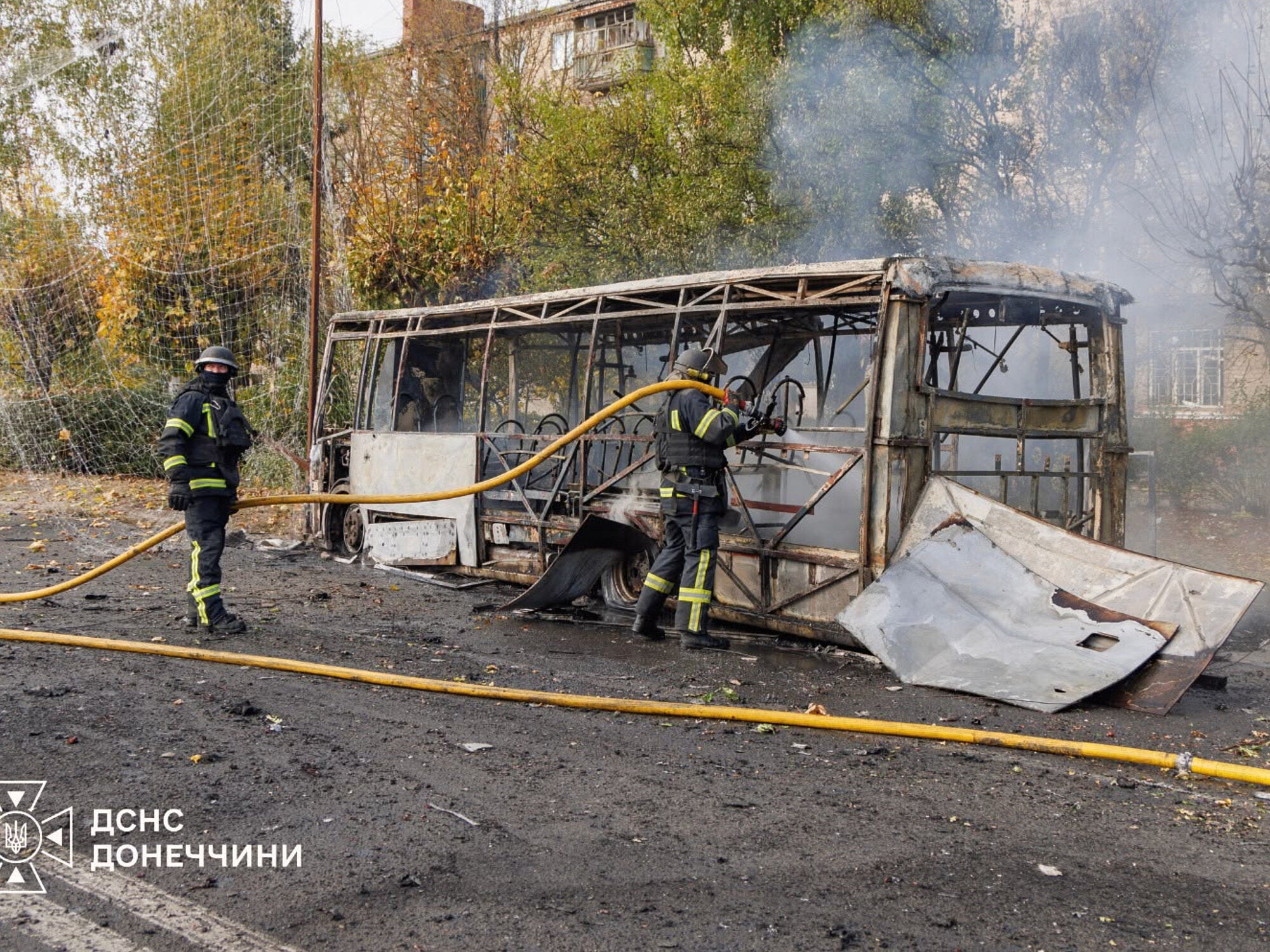 In this photo provided by the Ukrainian Emergency Service, firefighters extinguish a burning bus after a Russian attack in Kramatorsk, Ukraine, Thursday, Oct. 8, 2026.
