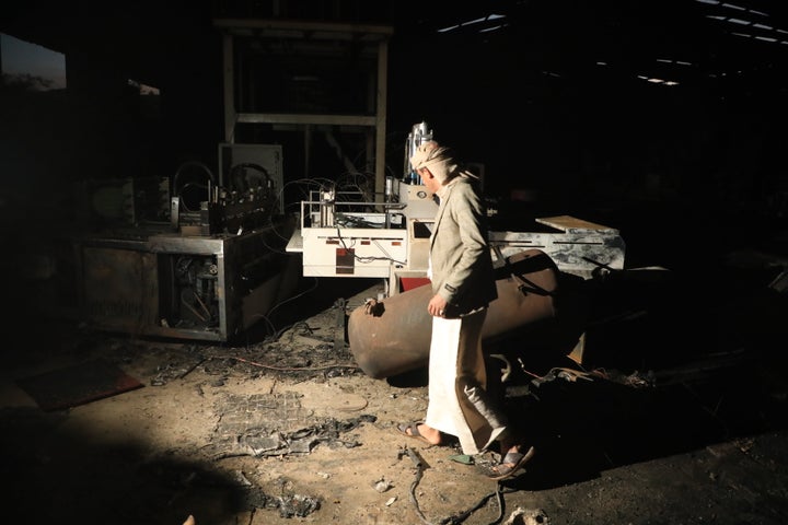A man walks inside a damaged sponge factory in Sanaa, Yemen, Sunday, Oct. 4, 2026.