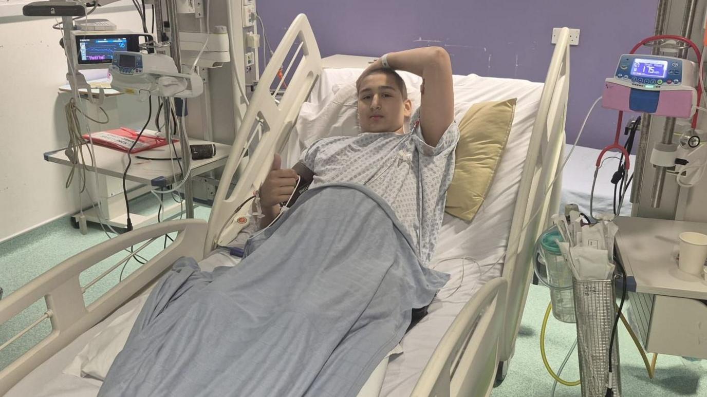 Ethan in a hospital bed