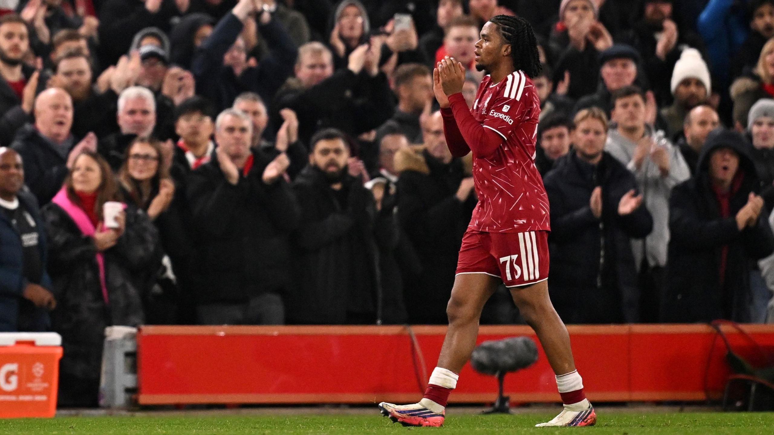 Rio Ngumoha applauds Liverpool's fans as they clap him off the pitch