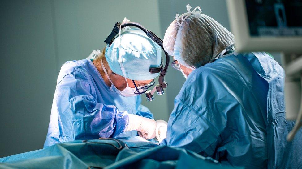 Two surgeons working